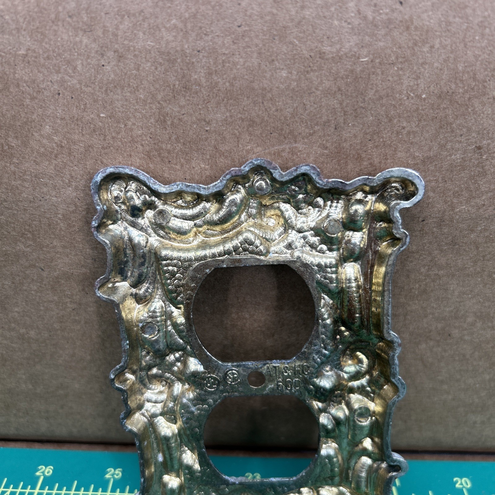 American Tack & Hardware Outlet Plate Provincial 60D Floral Has Corrosion