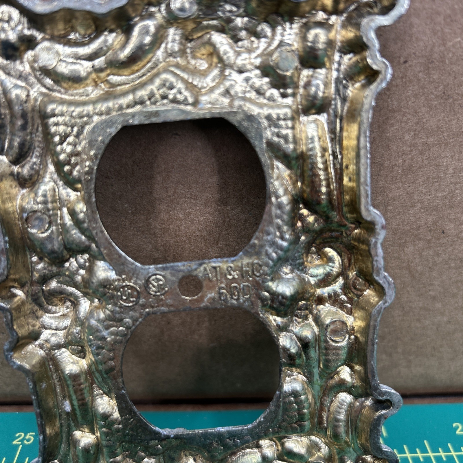 American Tack & Hardware Outlet Plate Provincial 60D Floral Has Corrosion