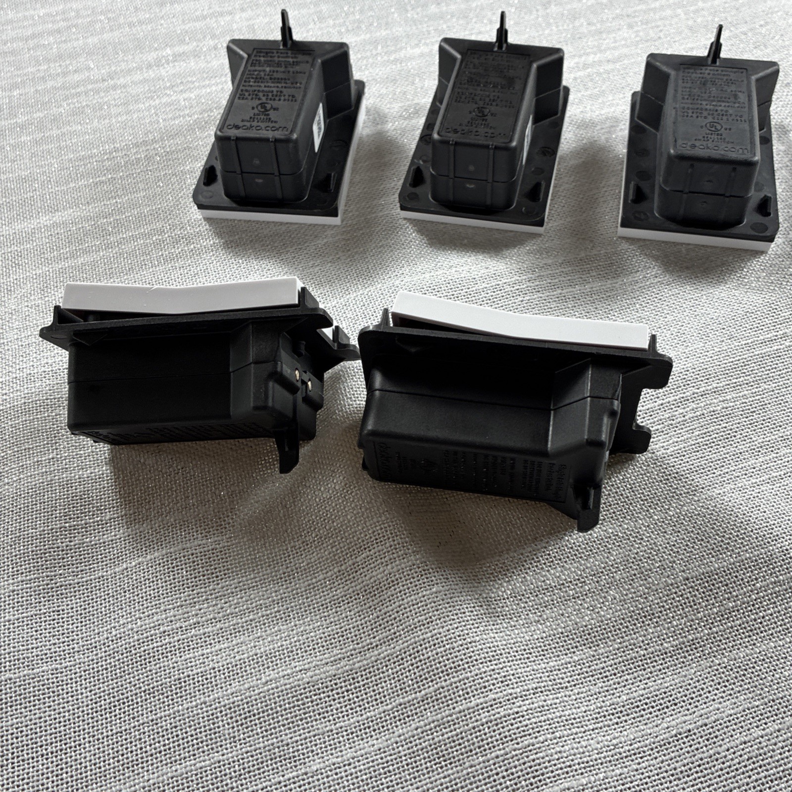 Deako Simple Snap Light 5 Switches in white. These are standard on/off switches