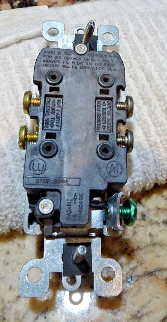 Pair of Gray Leviton Decora 15 Amp Side Wired Self Grounding Duplex Outlets