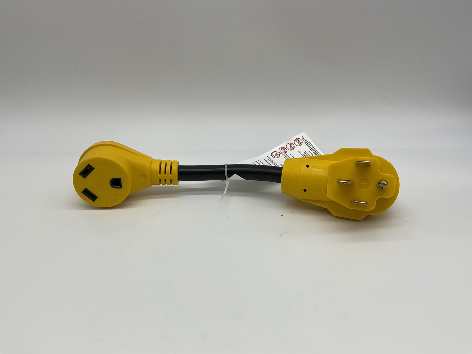 Camco Dogbone Power Grip adapter 15. Female, 30 A Male 125 Volts for mobile home